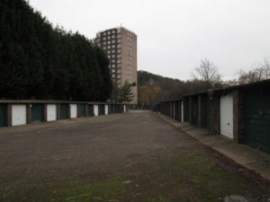 The old derelict garages before work started on site