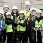 Curo marks new construction start with time capsule burial