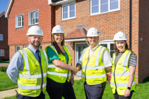 Thakeham team in front of developement