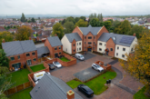 Local partners celebrate the completion of new homes in Holmewood