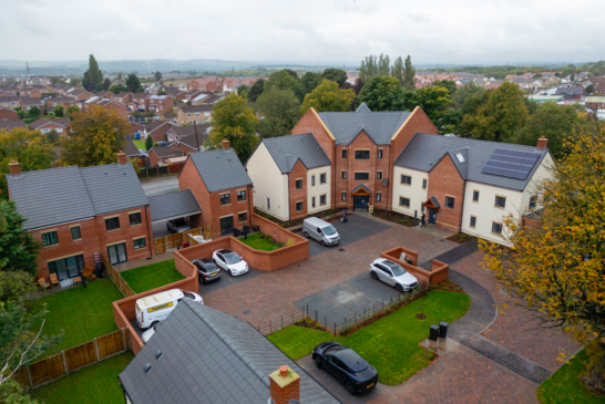 Local partners celebrate the completion of new homes in Holmewood