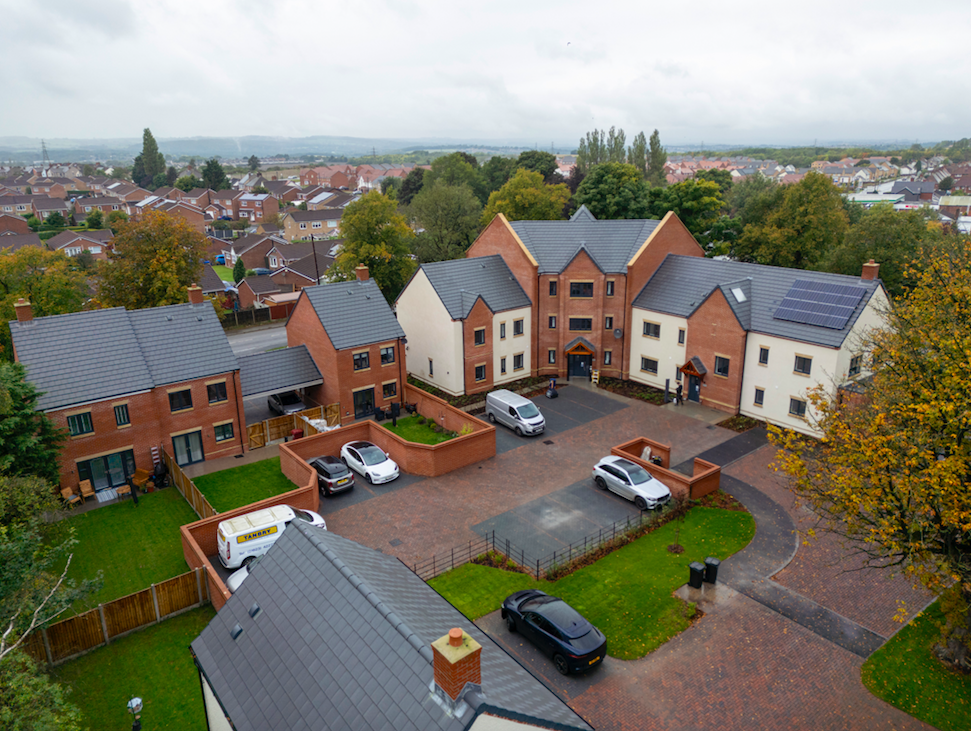 Local partners celebrate the completion of new homes in Holmewood